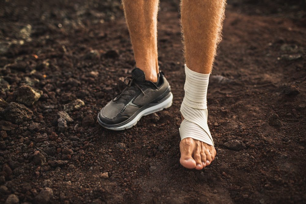 Men's ankle with compression bandage.